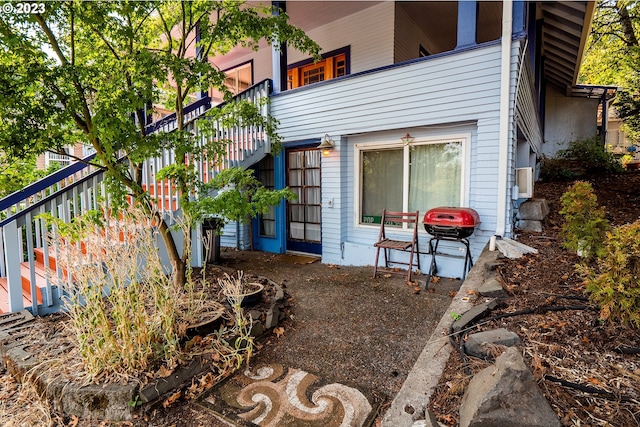 view of home's exterior featuring stairs