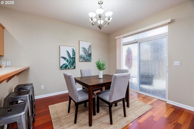 249 NW Mandi St, Hillsboro, OR 97124 - dining room featuring a chandelier, baseboards, and wood finished floors