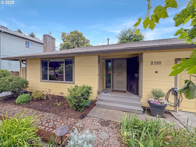 2320 SW Canby Ct, Portland, OR 97219 - property entrance featuring a chimney