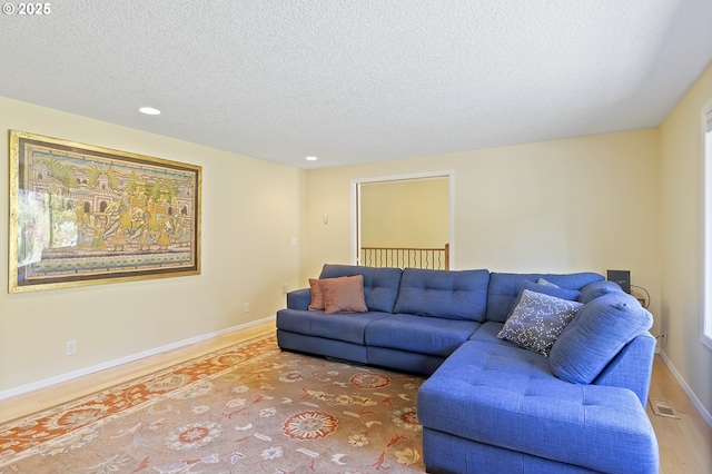 2320 SW Canby Ct, Portland, OR 97219 - living area featuring a textured ceiling, recessed lighting, and wood finished floors