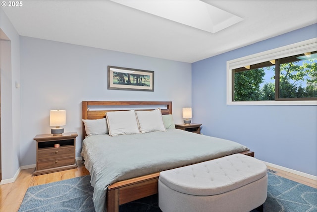 2320 SW Canby Ct, Portland, OR 97219 - bedroom featuring a skylight and wood finished floors