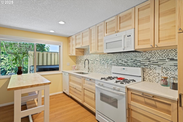 2320 SW Canby Ct, Portland, OR 97219 - kitchen featuring white appliances, light brown cabinets, light countertops, tasteful backsplash, and recessed lighting