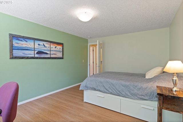 2320 SW Canby Ct, Portland, OR 97219 - bedroom with wood finished floors and a textured ceiling