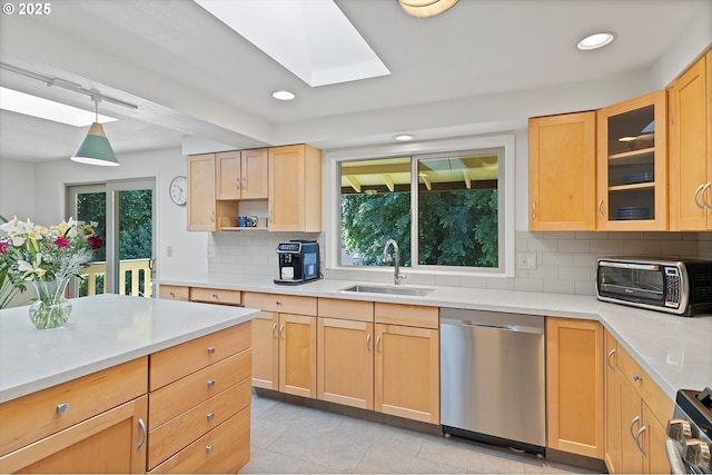 2320 SW Canby Ct, Portland, OR 97219 - kitchen featuring stainless steel appliances, light brown cabinets, light countertops, a skylight, and recessed lighting