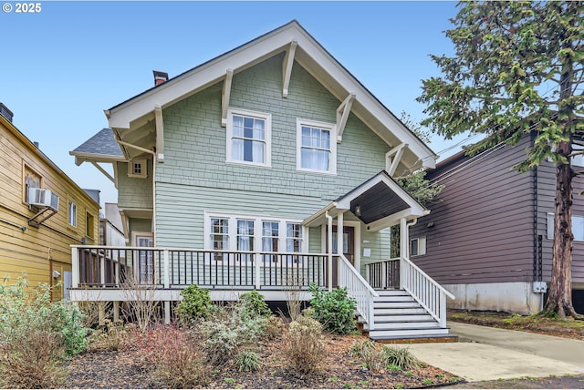 view of front of property with a porch and a chimney