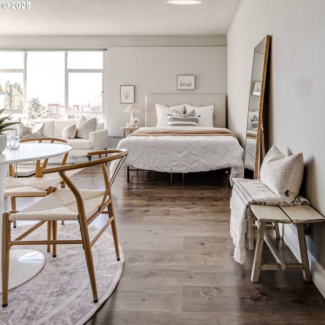 bedroom with wood-type flooring