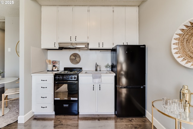 kitchen featuring white cabinetry, sink, dark hardwood / wood-style flooring, and black appliances