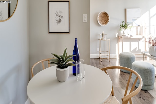 dining space with light wood-type flooring