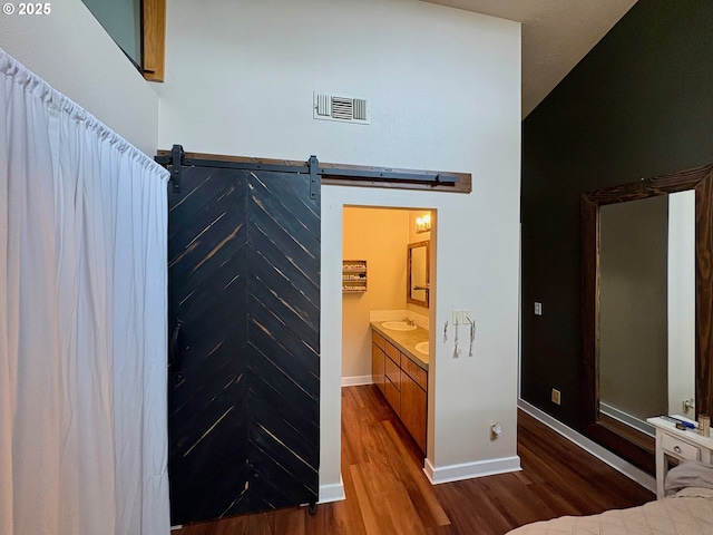 892 S 55th Pl, Springfield, OR 97478 - bathroom featuring wood finished floors, vanity, and baseboards