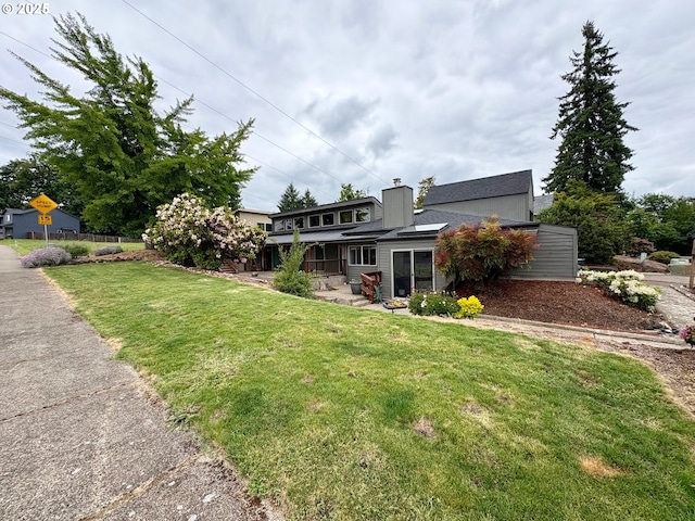 892 S 55th Pl, Springfield, OR 97478 - back of house featuring a lawn and a chimney