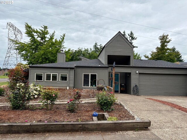 892 S 55th Pl, Springfield, OR 97478 - view of front of property with an attached garage, driveway, roof with shingles, and a chimney
