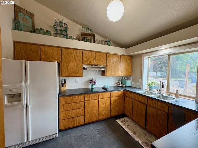 892 S 55th Pl, Springfield, OR 97478 - kitchen featuring white fridge with ice dispenser, a sink, lofted ceiling, under cabinet range hood, and tasteful backsplash