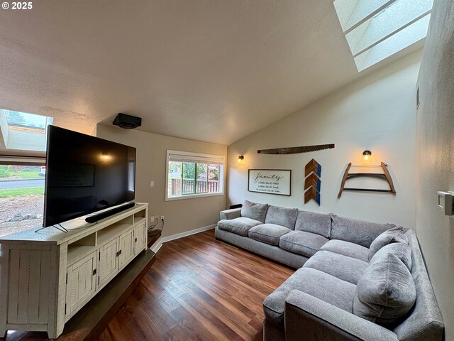 892 S 55th Pl, Springfield, OR 97478 - living area with a skylight, lofted ceiling, dark wood finished floors, and baseboards