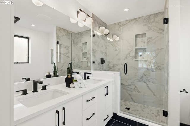 full bathroom with a sink, recessed lighting, and a shower stall