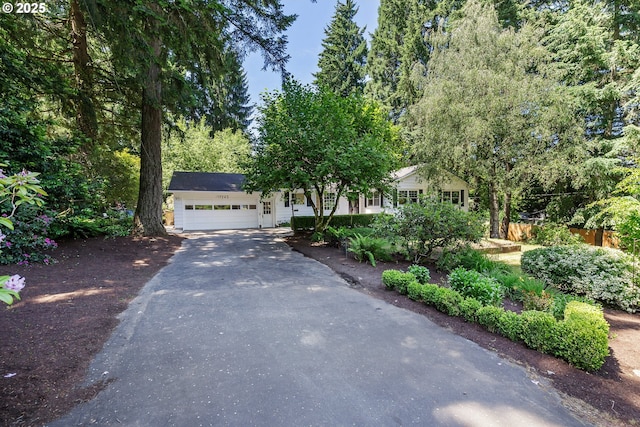 17243 Fernwood Dr, Lake Oswego, OR 97034 - obstructed view of property featuring driveway and a garage