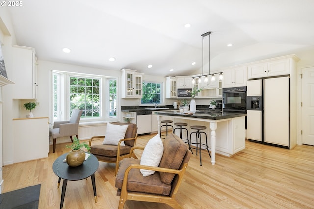 17243 Fernwood Dr, Lake Oswego, OR 97034 - living area featuring light wood-type flooring, vaulted ceiling, and recessed lighting