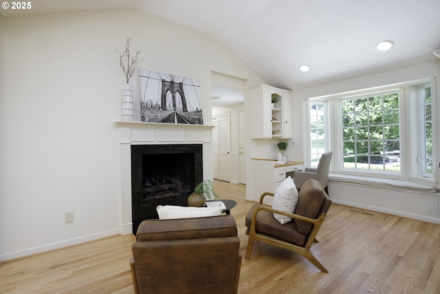 17243 Fernwood Dr, Lake Oswego, OR 97034 - living area featuring vaulted ceiling, light wood finished floors, a fireplace, baseboards, and recessed lighting