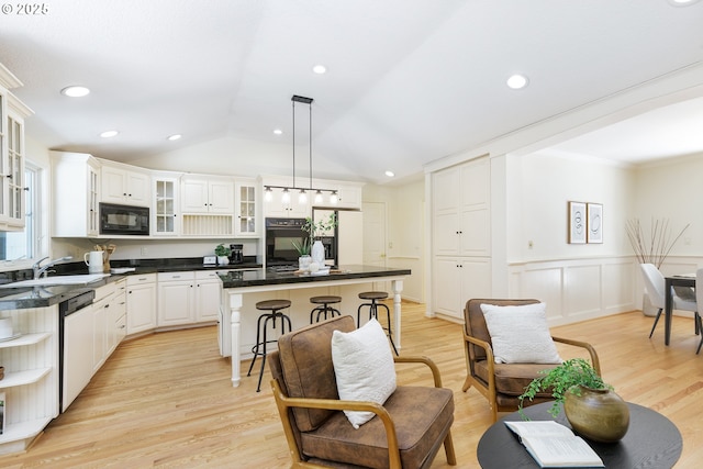 17243 Fernwood Dr, Lake Oswego, OR 97034 - kitchen with black appliances, a center island, dark countertops, a sink, and open shelves