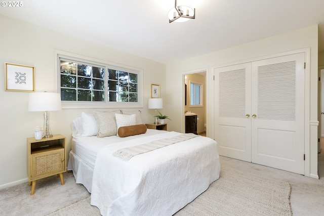 17243 Fernwood Dr, Lake Oswego, OR 97034 - bedroom with carpet flooring, a closet, connected bathroom, and baseboards