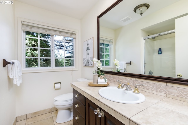 17243 Fernwood Dr, Lake Oswego, OR 97034 - full bathroom featuring vanity, an enclosed shower, healthy amount of natural light, and toilet