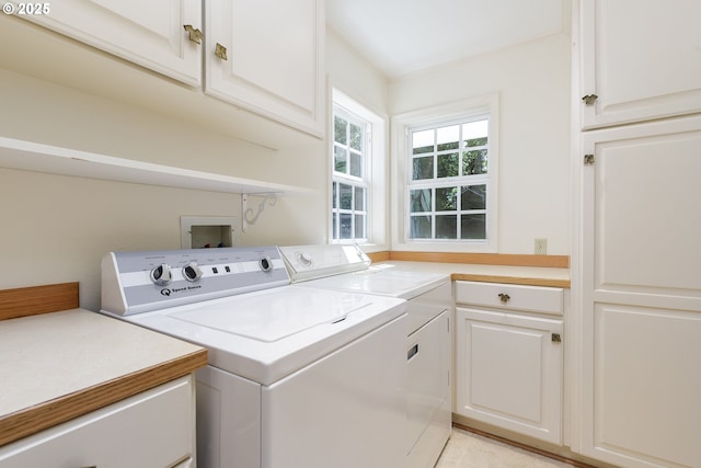 17243 Fernwood Dr, Lake Oswego, OR 97034 - laundry area featuring washer and dryer, cabinet space, and ornamental molding