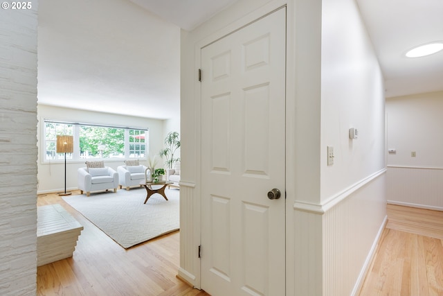 17243 Fernwood Dr, Lake Oswego, OR 97034 - corridor with wood finished floors, a wainscoted wall, and baseboards