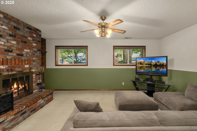 1415 SE 52nd Ave, Hillsboro, OR 97123 - living area with carpet, a ceiling fan, plenty of natural light, a fireplace, and a textured ceiling