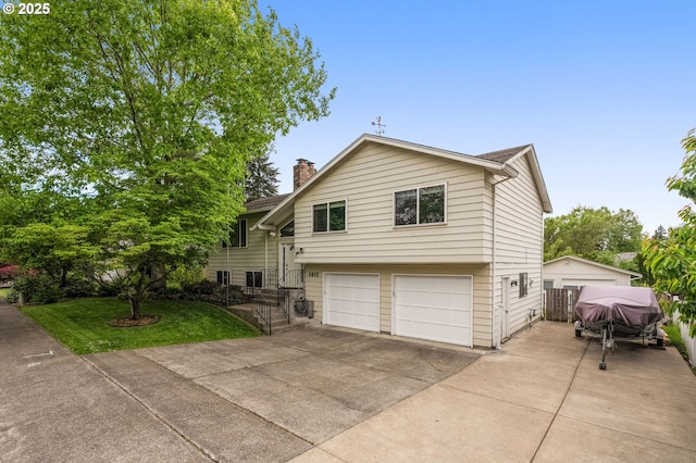 1415 SE 52nd Ave, Hillsboro, OR 97123 - view of front of home with a garage, a chimney, and driveway