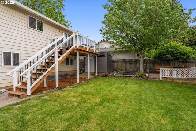 1415 SE 52nd Ave, Hillsboro, OR 97123 - view of yard featuring a storage unit, a wooden deck, stairs, and an outdoor structure