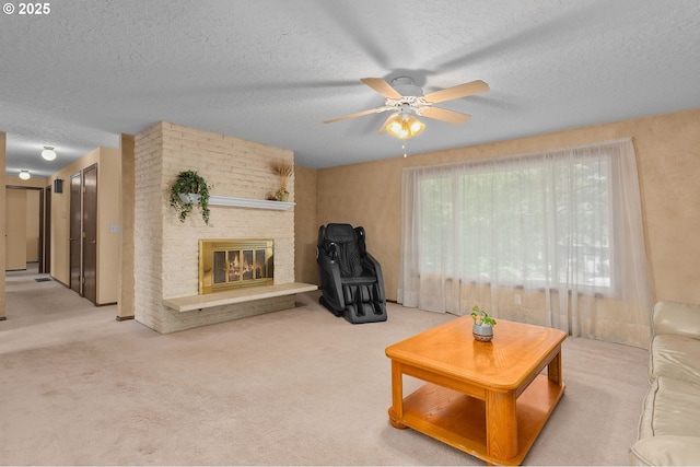 1415 SE 52nd Ave, Hillsboro, OR 97123 - carpeted living room featuring a textured ceiling, ceiling fan, and a fireplace