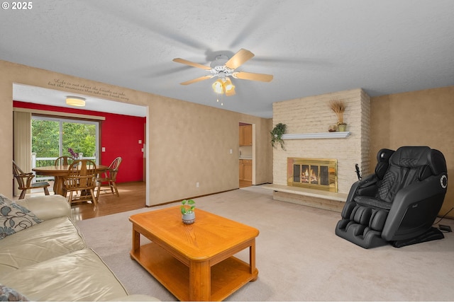 1415 SE 52nd Ave, Hillsboro, OR 97123 - living area featuring a ceiling fan, a brick fireplace, and a textured ceiling