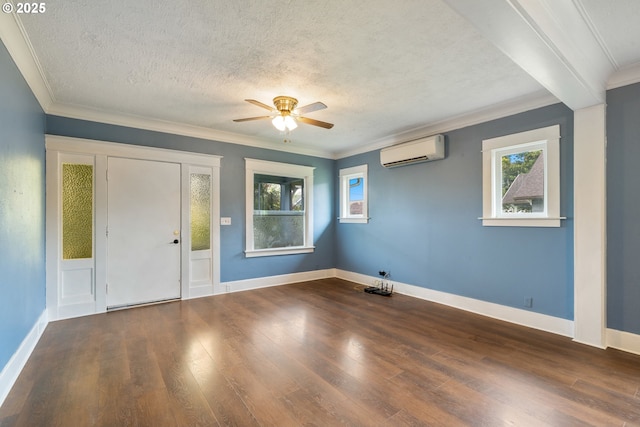 1006 Stillwell Ave, Tillamook, OR 97141 - entryway with a wall mounted AC, ceiling fan, wood finished floors, a textured ceiling, and crown molding