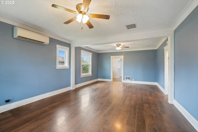 1006 Stillwell Ave, Tillamook, OR 97141 - unfurnished room featuring a wall mounted AC, a ceiling fan, hardwood / wood-style flooring, crown molding, and baseboards