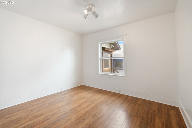 1006 Stillwell Ave, Tillamook, OR 97141 - empty room with wood finished floors and baseboards