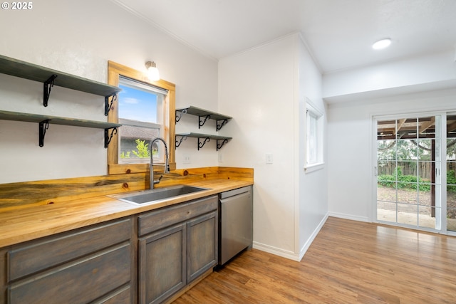 1006 Stillwell Ave, Tillamook, OR 97141 - kitchen with open shelves, wooden counters, a sink, stainless steel dishwasher, and crown molding
