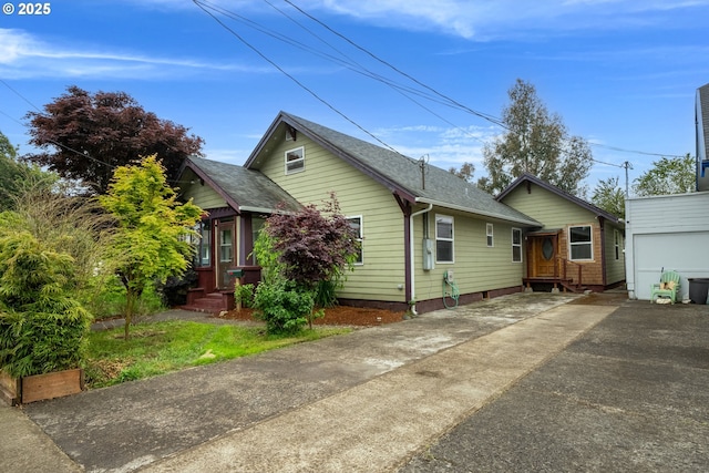 1006 Stillwell Ave, Tillamook, OR 97141 - view of front of home with a shingled roof and driveway