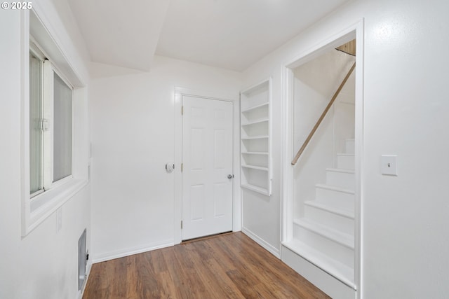 1006 Stillwell Ave, Tillamook, OR 97141 - hallway with stairway, wood finished floors, and baseboards