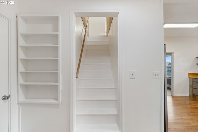1006 Stillwell Ave, Tillamook, OR 97141 - staircase with wood finished floors and baseboards