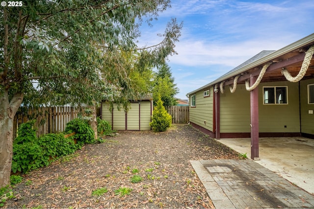 1006 Stillwell Ave, Tillamook, OR 97141 - fenced backyard featuring a patio area