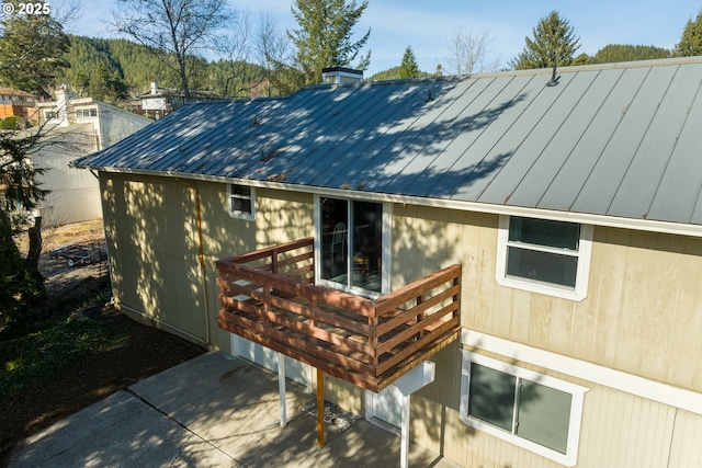 1521 Ranch Rd, Reedsport, OR 97467 - view of side of home featuring metal roof and a wooden deck