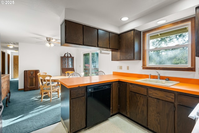 1521 Ranch Rd, Reedsport, OR 97467 - kitchen featuring black dishwasher, a sink, light countertops, a peninsula, and dark brown cabinetry