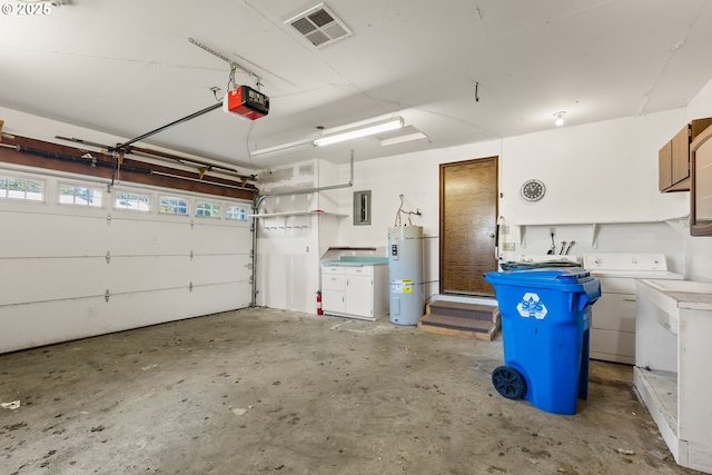 1521 Ranch Rd, Reedsport, OR 97467 - garage featuring secured water heater, a garage door opener, electric panel, and washer and dryer