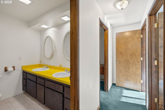 1521 Ranch Rd, Reedsport, OR 97467 - bathroom with toilet, double vanity, and baseboards