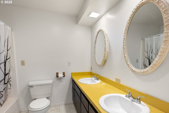 1521 Ranch Rd, Reedsport, OR 97467 - bathroom with toilet, baseboards, and double vanity