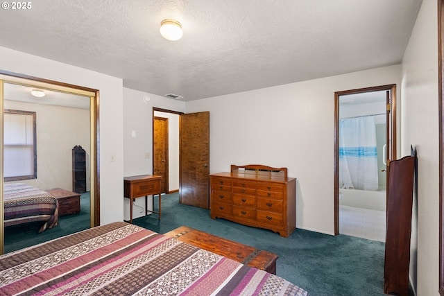 1521 Ranch Rd, Reedsport, OR 97467 - bedroom featuring carpet flooring, a textured ceiling, and ensuite bathroom
