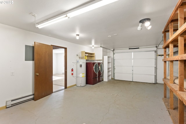 1521 Ranch Rd, Reedsport, OR 97467 - garage with a baseboard radiator, secured water heater, and separate washer and dryer
