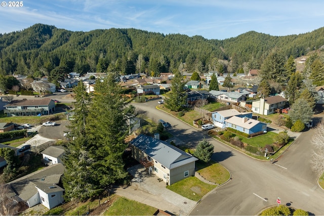1521 Ranch Rd, Reedsport, OR 97467 - aerial view of residential area with a heavily wooded area