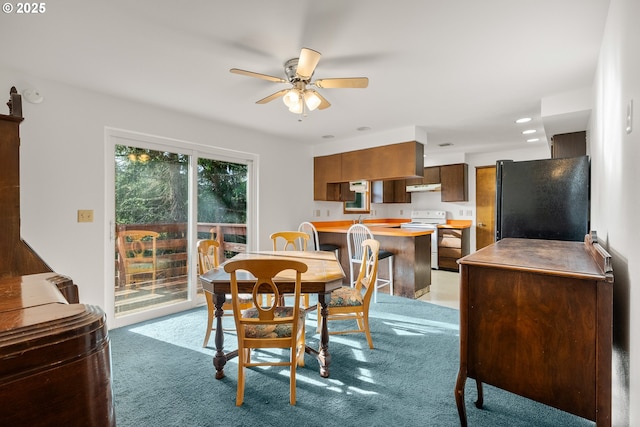 1521 Ranch Rd, Reedsport, OR 97467 - dining space with a ceiling fan, light colored carpet, and recessed lighting