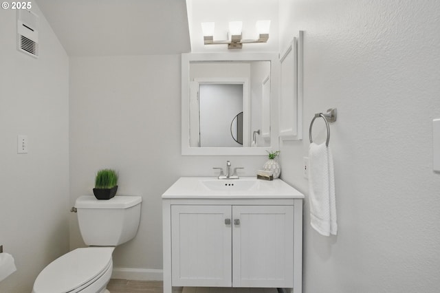29460 SW Volley St Unit 67, Wilsonville, OR 97070 - bathroom featuring toilet, vanity, and baseboards
