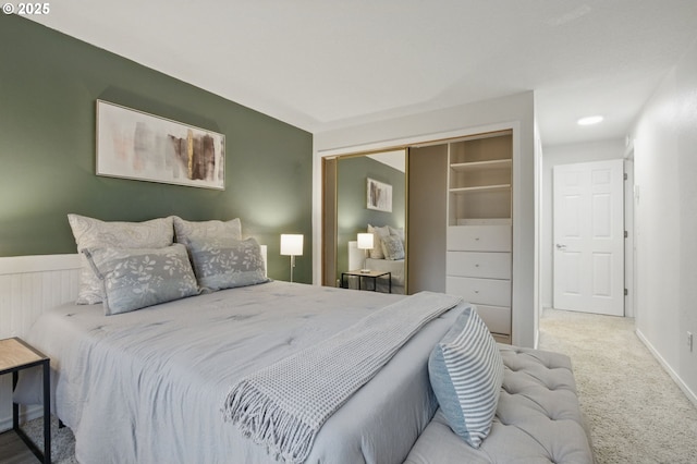 carpeted bedroom with a closet